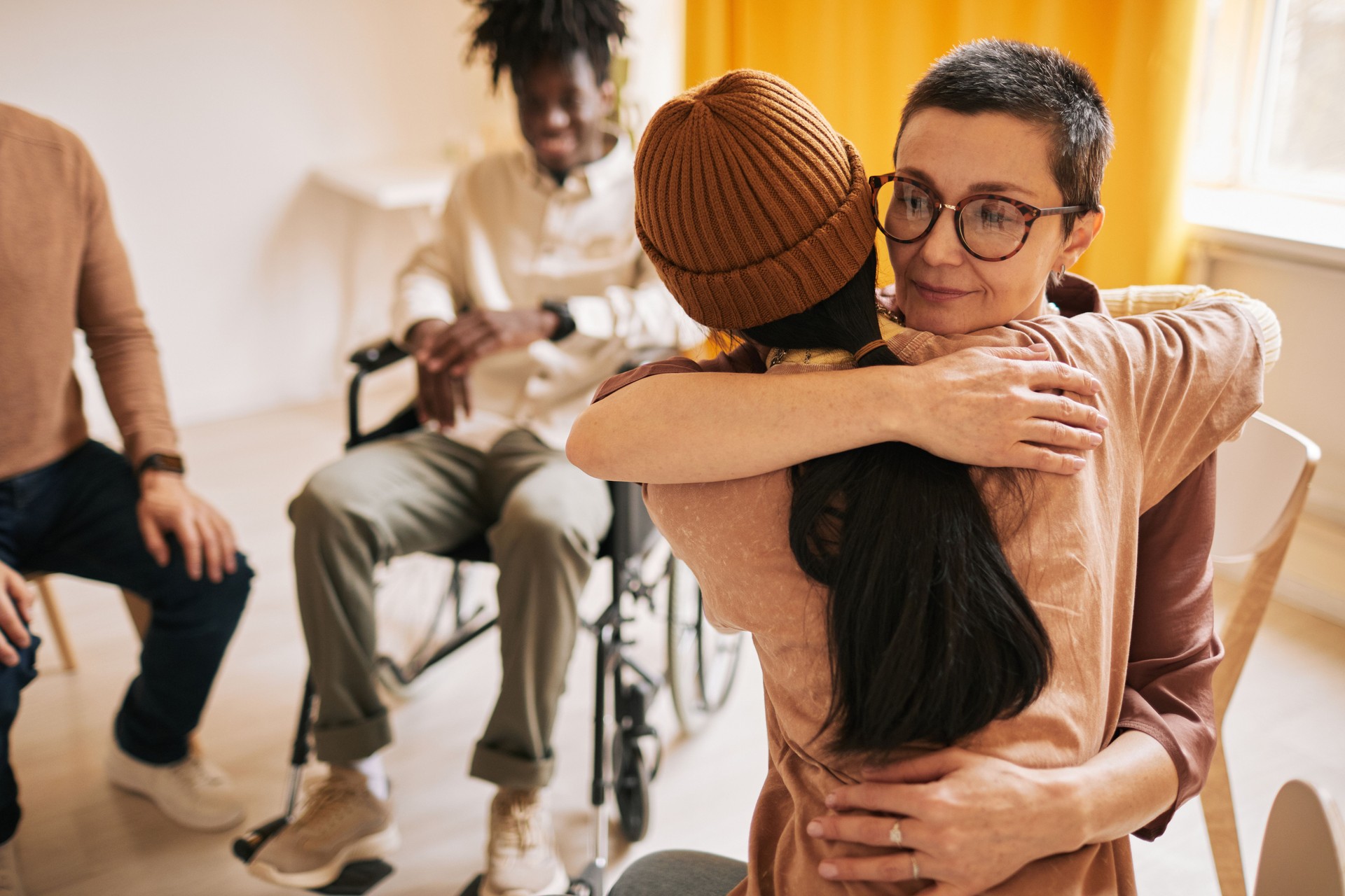 Women Embracing at Therapy Session